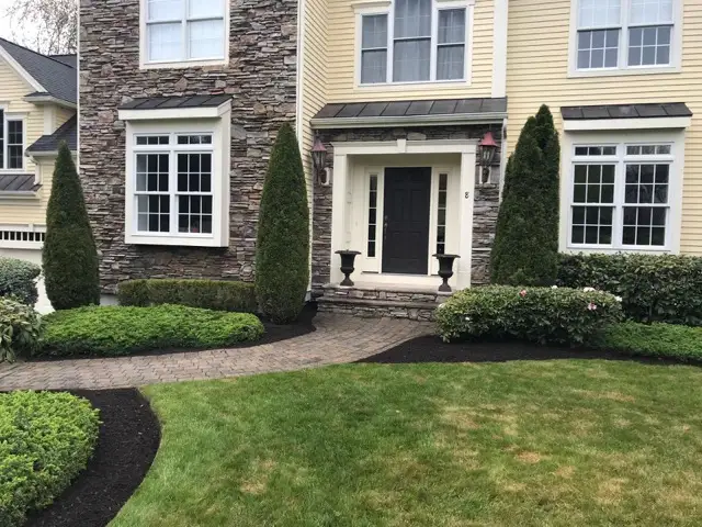 Shrubs and mulch at a home entrance