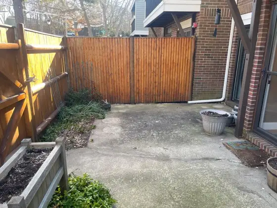 Worn concrete patio before replacement