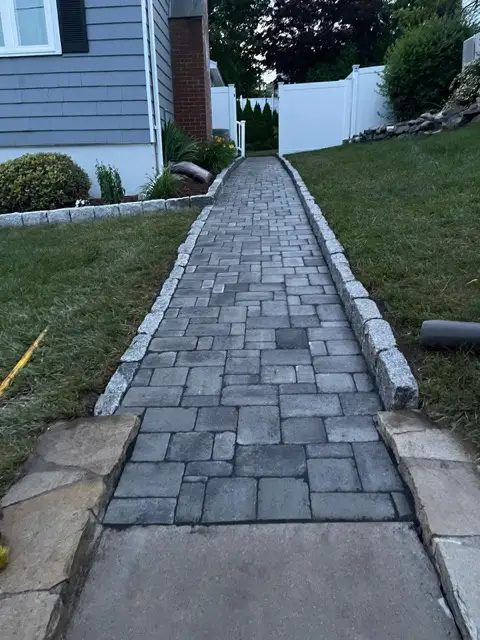 Paver walkway along a lawn